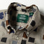 A close-up of the button down collar.