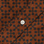 The white button on the stitched placket.