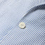 A close-up of the button on the Blue Stripe Seersucker Simple Jackets fabric.