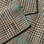 A close-up of the button hole on the lapel.