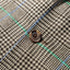 The button on the Grey Glen Plaid Simple Jacket.