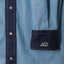 The stitched placket with Pearl snap buttons and ND embroidered on the sleeve.