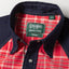 A close-up of the button up collar on the Nicholas Daley Jamaican Bandanna Western shirt with pearl snap buttons.