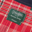 A close-up look at the Gitman Vintage x Nicholas Daley Tag.