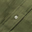The white chalk button on the stitched placket.