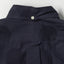 The back of the Navy Dobby Dot
 shirt with a locker loop and a white chalk button on the back of the collar.