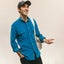 Blue 16-Wale Corduroy sport shirt worn by a model, showcasing its fine-wale cotton corduroy fabric, button-down collar, and classic menswear fit.