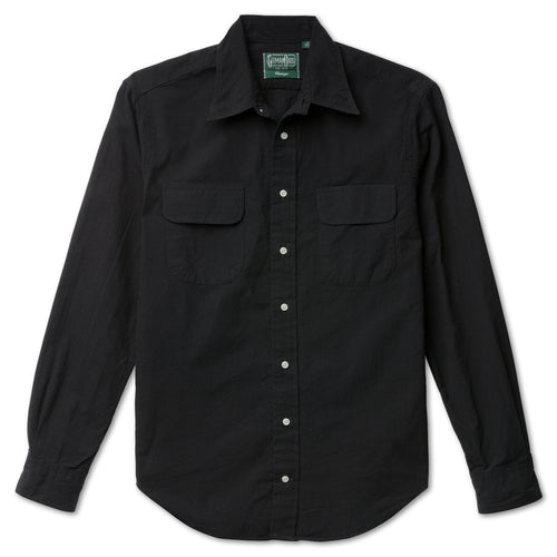 The Black Nepped Silk shirt made from Japanese raw silk and features flap pockets and a button free collar with white buttons and barrel cuffs.