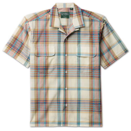The Tan Archive Madras Camp Shirt, with short sleeves and two front pockets and white buttons on the front.