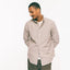 The drape of the Grey Striped Japanese Poplin on the body of a model.