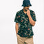 The Black Hawaiian Print Camp Shirt on the body of a model showing the drape and the versatility.