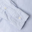 Blue striped button down oxford shirt, made in the USA, 100% cotton, white button, buttoned sleeve, buttoned cuff.