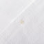 The button on the  placket on the White Seersucker Camp Shirt.