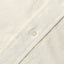 A white button on the lined placket.