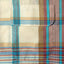 The front flap pocket on the Tan Archive Madras Camp Shirt.