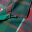 The top button loop on the Plum Archive Madras Camp Shirt.