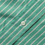 A white button on the lined placket.