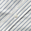 A white button on the lined placket.