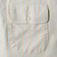 A close-up of the button through chest pocket.