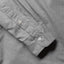 Close-up of the Grey Brushed Chambray sport shirt's lined cuff and buttons, showcasing its soft brushed chambray fabric.