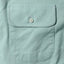 Close-up of the Teal Brushed Chambray sport shirt's chest pocket, showcasing the soft brushed chambray fabric and detailed construction.