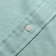 Close-up of the Teal Brushed Chambray sport shirt's button placket featuring classic buttons and soft brushed chambray fabric.