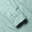 Close-up of the Teal Brushed Chambray sport shirt's lined cuff and buttons, showcasing its soft brushed chambray fabric.