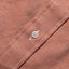 Close-up of the Burgundy Brushed Chambray sport shirt's button placket featuring classic buttons and soft brushed chambray fabric.
