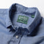 Close-up of the Blue Brushed Chambray sport shirt's button-down collar featuring a lined collar and classic button detail.