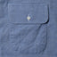 Close-up of the Blue Brushed Chambray sport shirt's chest pocket, showcasing the soft brushed chambray fabric and detailed construction.