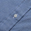 Close-up of the Blue Brushed Chambray sport shirt's button placket featuring classic buttons and soft brushed chambray fabric.