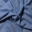 Close-up of the Blue Brushed Chambray sport shirt's brushed chambray fabric, showcasing its soft texture and rich blue color.