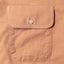 Close-up of the Orange Brushed Chambray sport shirt's chest pocket, showcasing the soft brushed chambray fabric and detailed construction.