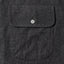 Close-up of the Charcoal Silk Denim sport shirt's chest pocket, showcasing the charcoal silk denim fabric and detailed construction.