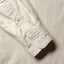 Close-up of the Ecru Silk Denim sport shirt's lined cuff and buttons, showcasing its smooth silk denim fabric.