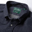 Close-up of the Indigo Silk Denim sport shirt's button-down collar featuring a lined collar and classic button detail.