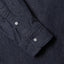 Close-up of the Indigo Silk Denim sport shirt's lined cuff and buttons, showcasing its smooth silk denim fabric.