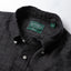 Close-up of the Charcoal Albini Linen Flannel sport shirt's button-down collar featuring a lined collar and classic button detail.