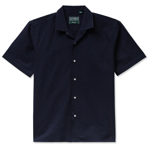 The Navy Overdye Seersucker Camp Shirt crafted from lightweight 3.5oz cotton seersucker. Featuring a tonal stripe and relaxed camp silhouette for breathable summer style. Made in the USA.