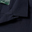 A closeup on the collar of the Navy Overdye Seersucker Camp Shirt.