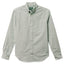 A green button down shirt with a chest pocket, made from a brushed oxford fabric with white buttons.