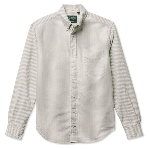 A grey striped button down shirt with a chest pocket, made from a brushed oxford fabric with white buttons.