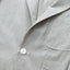 A closeup of the button and lapel of the Japanese seersucker Simple Jacket.