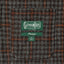The inside pocket of the grey checkered tweed simple jacket with the Gitman Vintage logo.