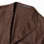 A closeup of the lapel of the Brown Donegal bouclé Simple Jacket.
