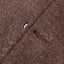 The button hole on the lapel of the Brown Donegal bouclé Simple Jacket.