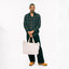 The Brown Checked Organic Cotton shirt on the body of a model showing the drape and styled with black pants  a tan boots.