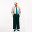 The light blue pinpoint oxford on the body of a model showing the drape and styled with a neck tie.
