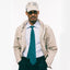 The light blue pinpoint oxford on the body of a model showing it styled with a tie and a coat.