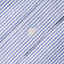 The button on the stitched placket on the Blue Stripe Seersucker shirt.